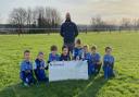 Chepstow Town under 8s are presented with a cheque from Persimmon Homes