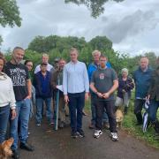 David Davies MP and Cllr Richard John with residents on Garrow Road in Mitchel Troy, one of the proposed sites known locally as the Cherry Orchard