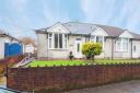This bungalow in Caerphilly is perfect for a family with pets with a large garden and conservatory