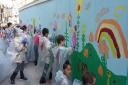 Pupils painting the hoardings