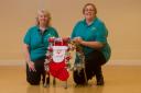 (L-R) Liz Evans and Rachel Mann from Ty Gwyn Residential Home in Fairwater, Cwmbran with the Zimmer frame that they decorated. Picture: Mark Lewis
