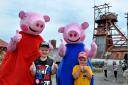 Oscar Stross, five, and his brother Troy, four, say hello to Peppa and George Pig