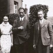 Myfanwy Haycock (left) in the garden at Mount Pleasant in Pontnewynydd with Huw Menai (centre) and her father Jimmy Pearce (right). Picture: Torfaen Museum.