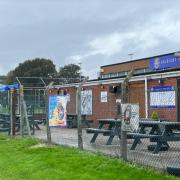 This fence at Caldicot Town's clubhouse has been described as 'unsightly' and is to be replaced with a wall.