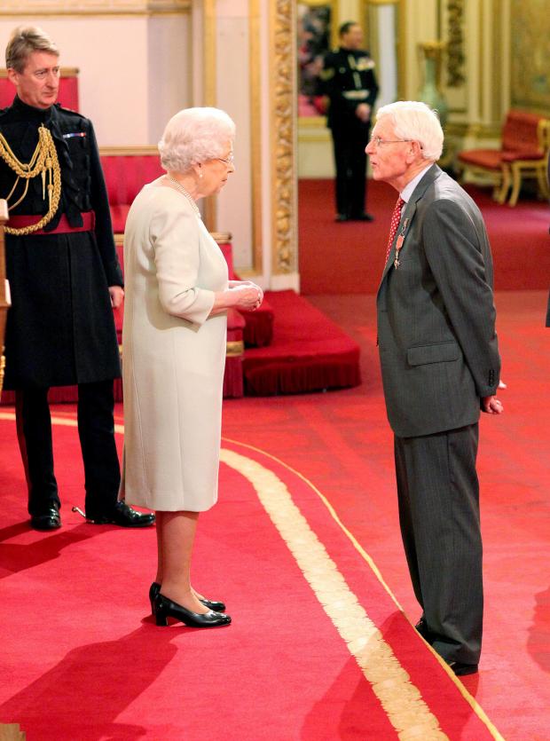 AWARD: Alexander Holt-Wilson of Raglan receives his honour from Queen Elizabeth at Buckingham Palace. Photo: Dominic Lipinski