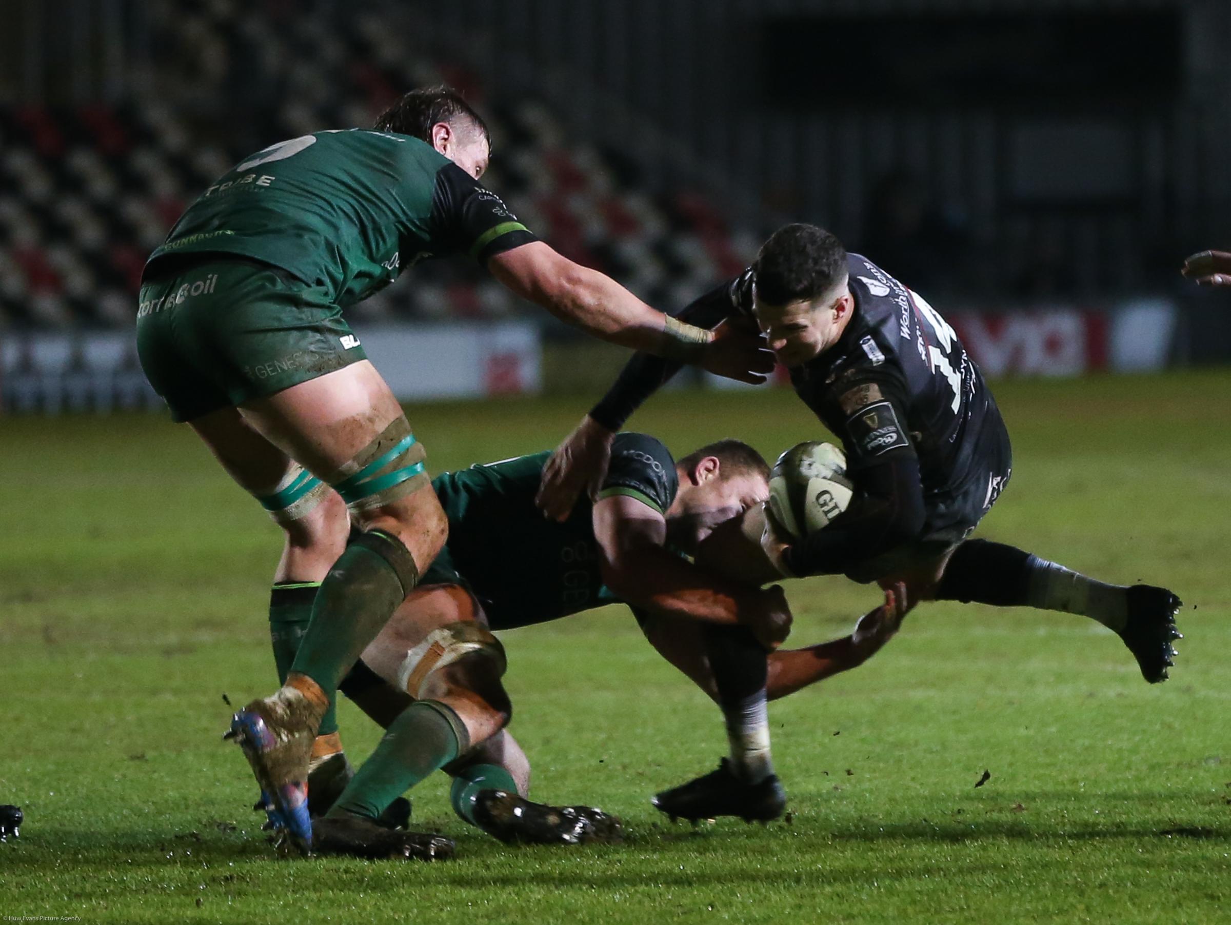 Owen Jenkins of Dragons is tackled by Oisin Dowling of Connacht