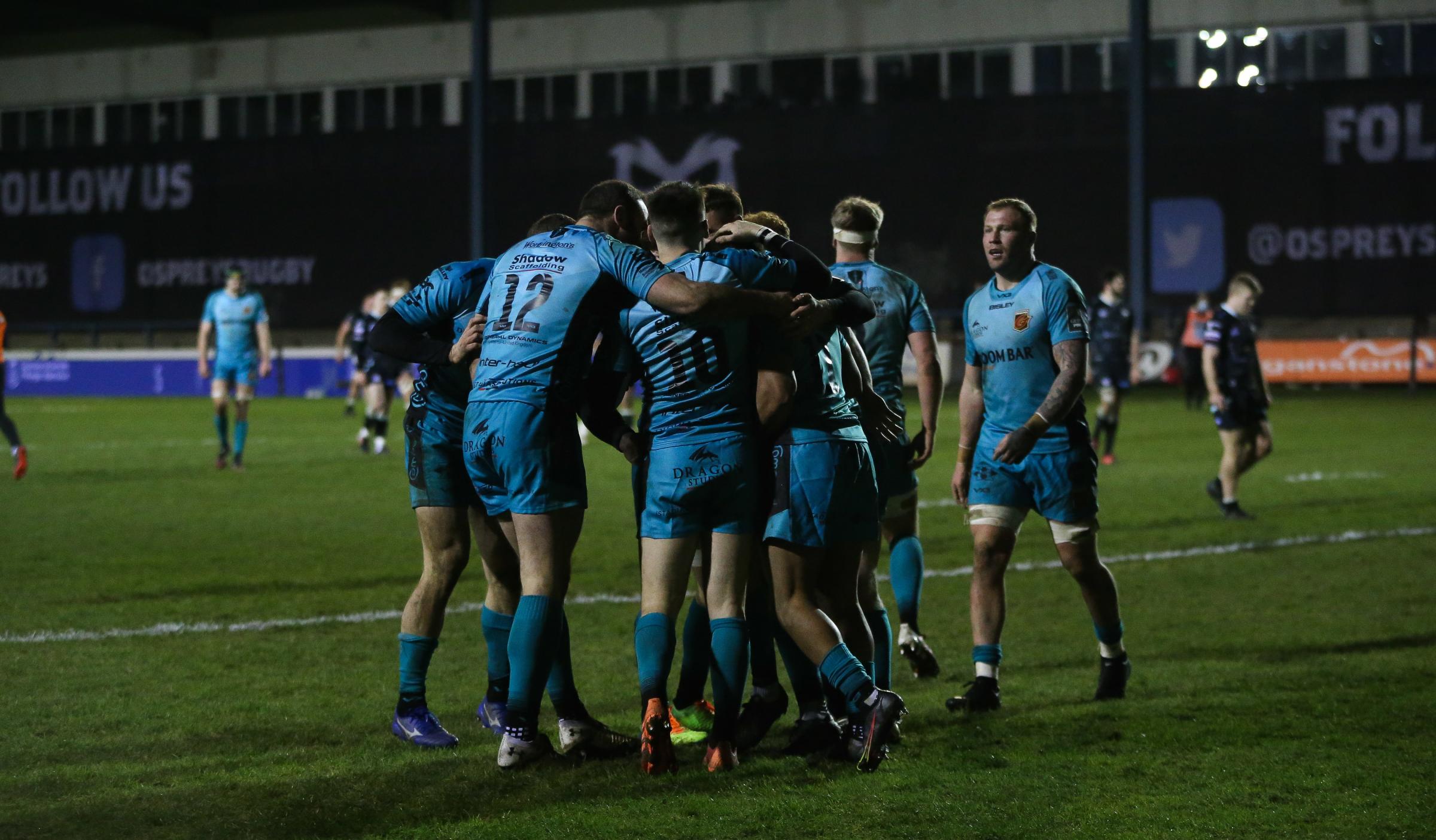 CELEBRATION: The Dragons celebrate Ashton Hewitts try that clinched victory against the Ospreys
