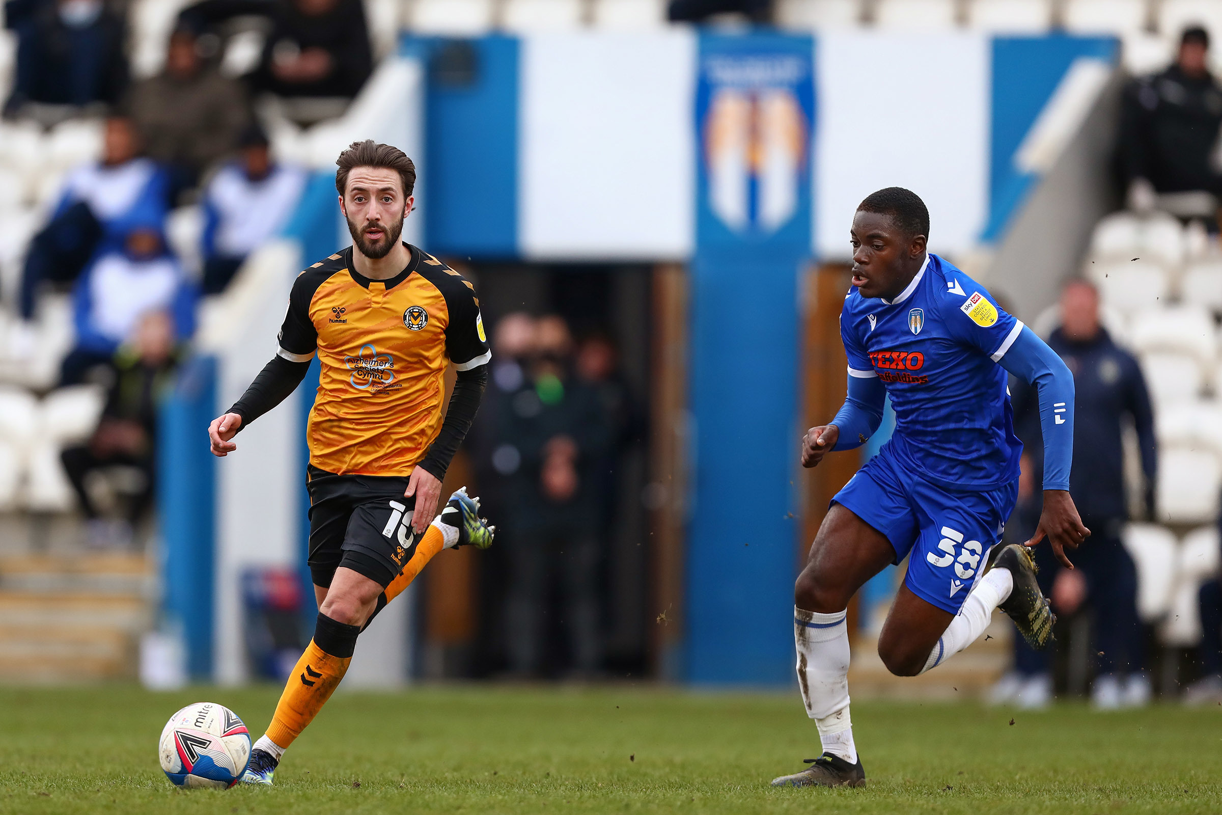 06.03.21 - Colchester United v Newport County - Sky Bet League 2 - Josh Sheehan of Newport County and Junior Tchamadeu of Colchester United.