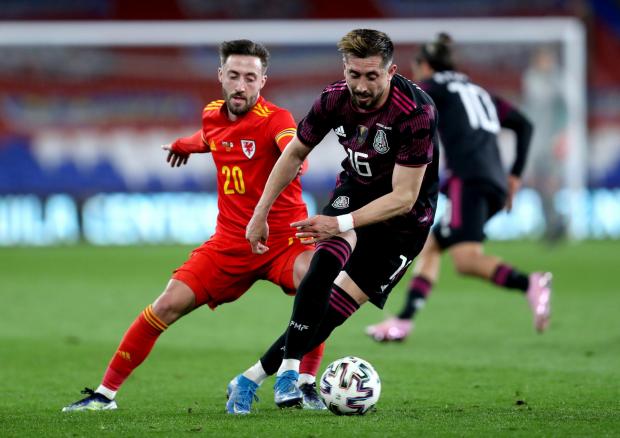Free Press Series: Wales\' Josh Sheehan (left) and Mexico\'s Hector Herrera battle for the ball during the international friendly at the Cardiff City Stadium, Cardiff. Picture date: Saturday March 27, 2021.