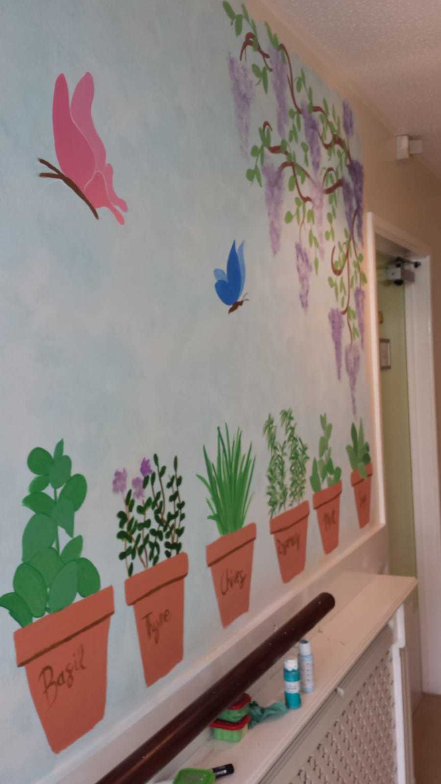 A mural leading outside at Thistle Court care home in Cwmbran, painted by staff member Rachel Davies. Picture: Thistle Court Care Home
