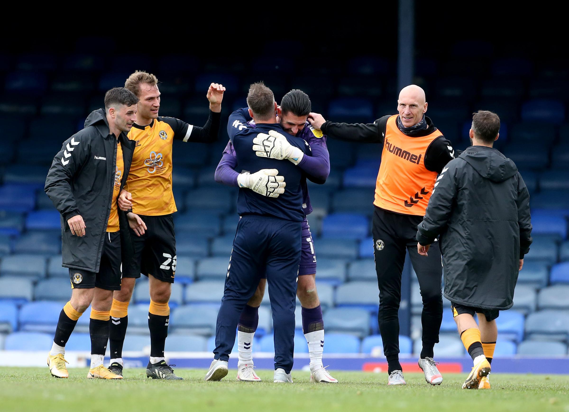 08.05.21 - Southend United v Newport County - Sky Bet League 2 - Newport County manager Michael Flynn and goalkeeper Tom King celebrate a 1-1 draw with Southend that means they are in the playoffs