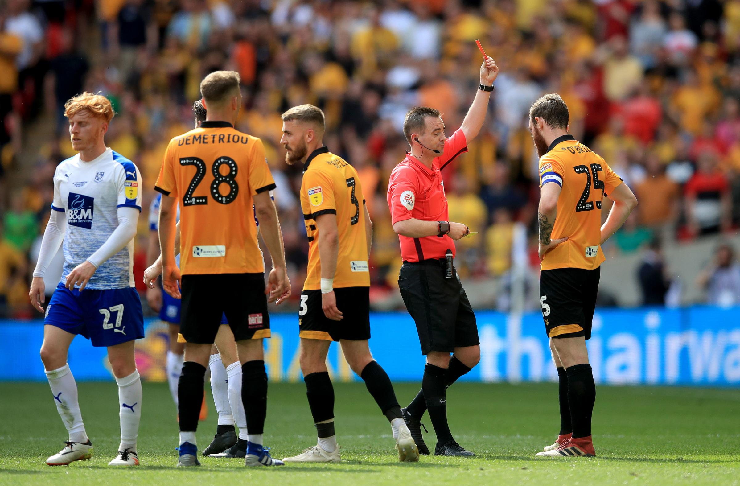 Match referee Ross Joyce shows a red card to Newport Countys Mark OBrien during the Sky Bet League Two Play-off final at Wembley Stadium, London. PRESS ASSOCIATION Photo. Picture date: Saturday May 25, 2019. See PA story SOCCER League Two. Photo