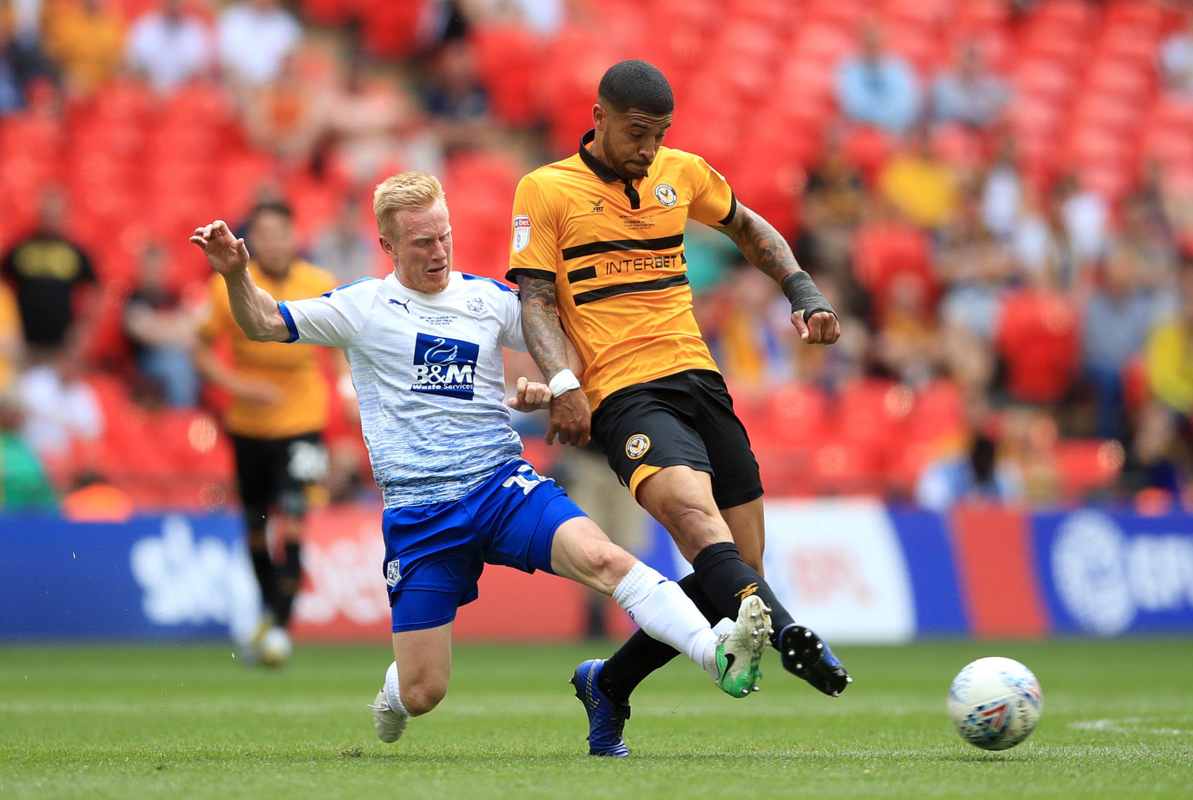 Tranmere Rovers David Perkins (left) and Newport Countys Joss Labadie battle for the ball during the Sky Bet League Two Play-off final at Wembley Stadium, London. PRESS ASSOCIATION Photo. Picture date: Saturday May 25, 2019. See PA story SOCCER