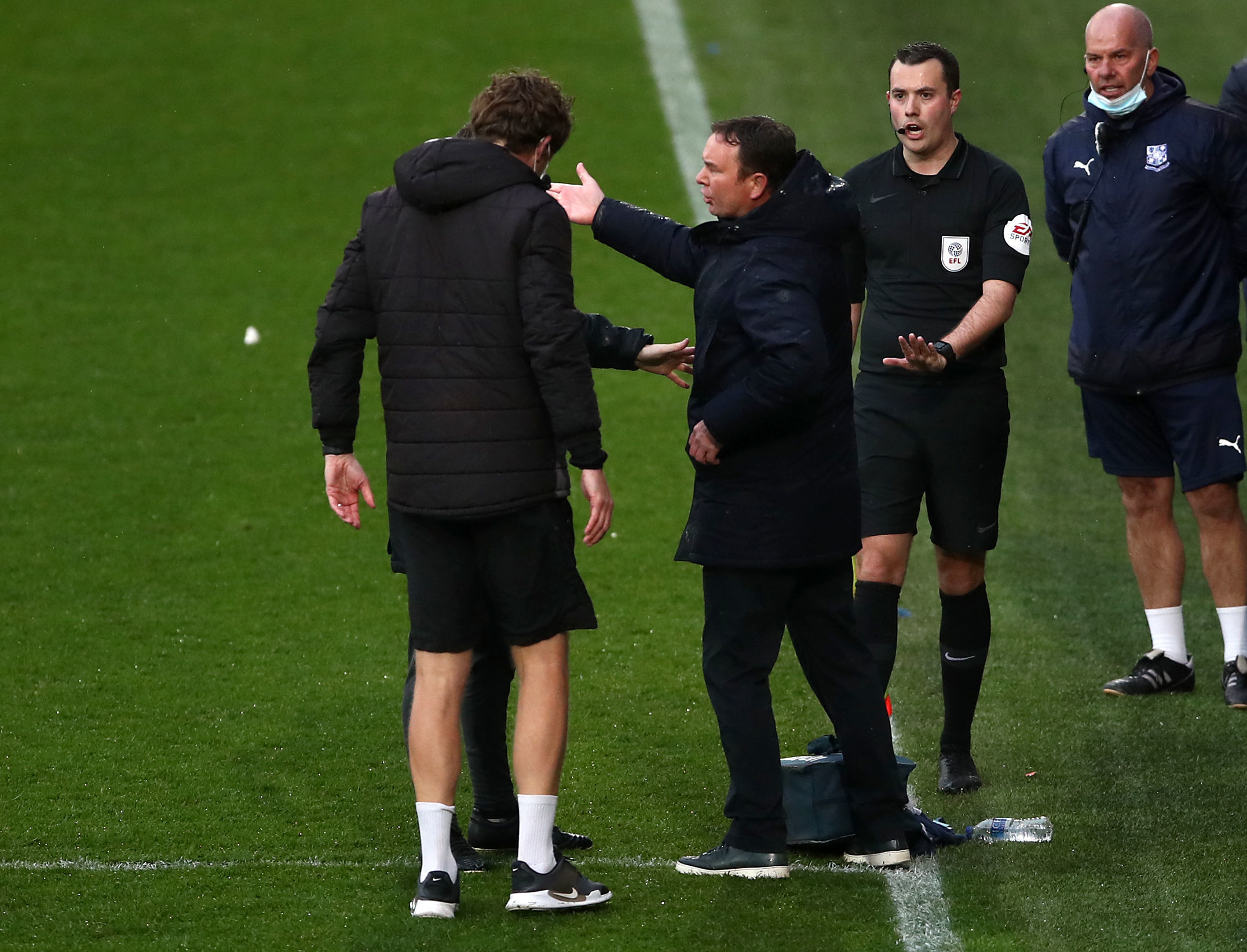 Morecambe manager Derek Adams argues with the officials during the Sky Bet League two, play-off semi final at Prenton Park, Tranmere. Picture date: Thursday May 20, 2021. PA Photo. See PA story SOCCER Tranmere. Photo credit should read: Tim Goode/PA