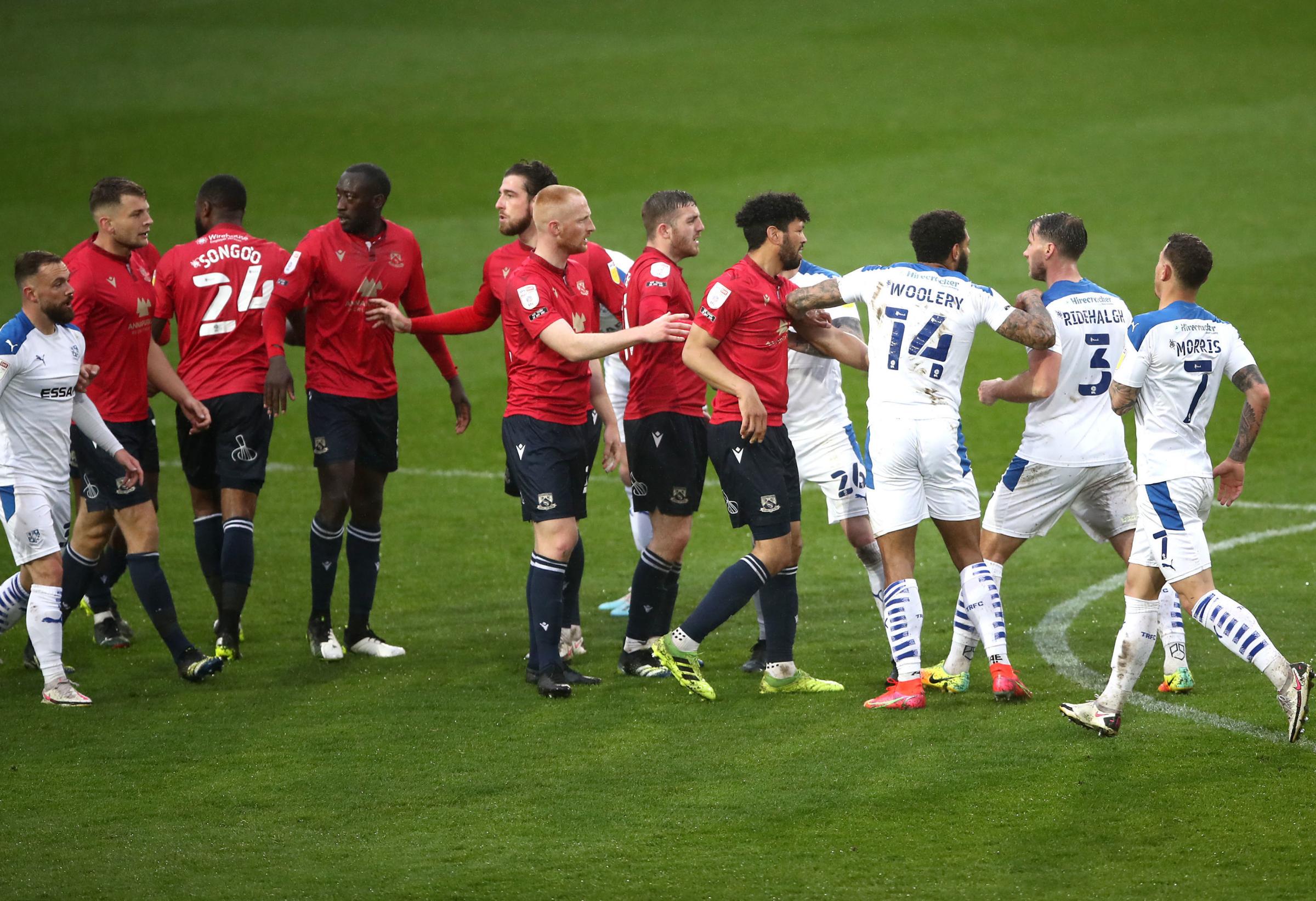 Tranmere Rovers and Morecambe players clash during the Sky Bet League two, play-off semi final at Prenton Park, Tranmere. Picture date: Thursday May 20, 2021. PA Photo. See PA story SOCCER Tranmere. Photo credit should read: Tim Goode/PA