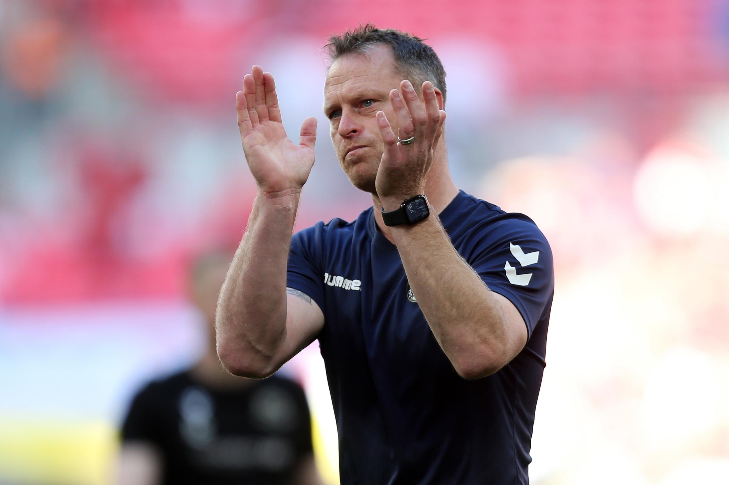 FRUSTRATED: County manager Michael Flynn applauds the fans at Wembley