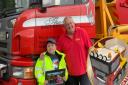 Caleb Plumley alongside Anthony Davies from Thomas Waste Management who surprised him with a birthday visit