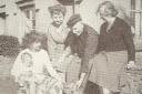 Elizabeth Beniams (right) with her son Tom and his wife Winifred sat on the wall, their daughter Janet and her baby Ian and their dog Lady. Picture: Torfaen Museum.