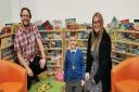 Matthew Geary from Torfaen Libraries presents Summer Reading Challenge winner Archie Fielding with his prize, along with mum Nicole Fielding. Picture: Torfaen council.