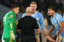 Manchester City’s Erling Haaland, goalkeeper Ederson (left) and Ruben Dias (right) react to referee Simon Hooper (centre) (Martin Rickett/PA)