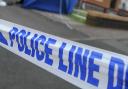 Cropped image showing a police cordon at a crime scene. Original picture: Huw Evans Picture Agency