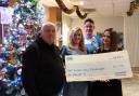 Ray Taylor, Emma Waldron, Ioan Protheroe and Emily Hedley with the money raised from the event at Llanyrafon Social Club.