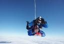 Monmouthshire woman Lisa Hicks (bottom) during her first tandem parachute jump