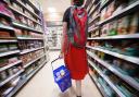 PA file photo of a shopper in a supermarket.