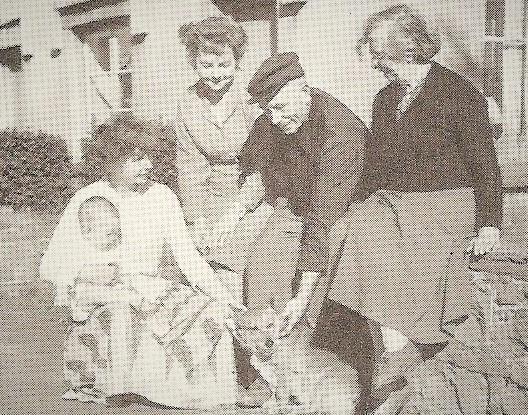 Elizabeth Beniams (right) with her son Tom and his wife Winifred sat on the wall, their daughter Janet and her baby Ian and their dog Lady. Picture: Torfaen Museum.