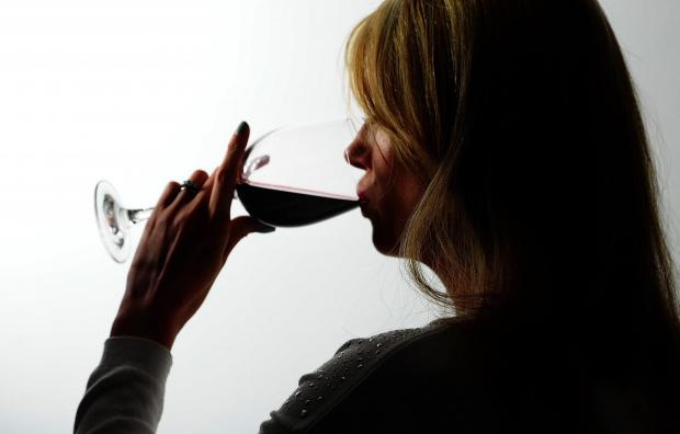 Free Press Series: A woman drinking red wine. Credit: PA