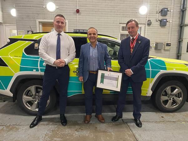 Welsh Ambulance Service chief executive Jason Killens, paramedic Gino Matrella and the High Sheriff of Gwent Phillip Alderman. Picture: Welsh Ambulance Service