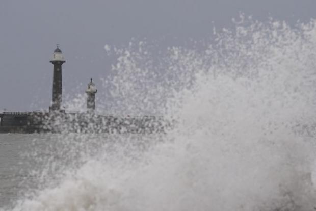 Free Press Series: Big waves against the sea wall in Whitby, Yorkshire. Photo via PA/Danny Lawson.