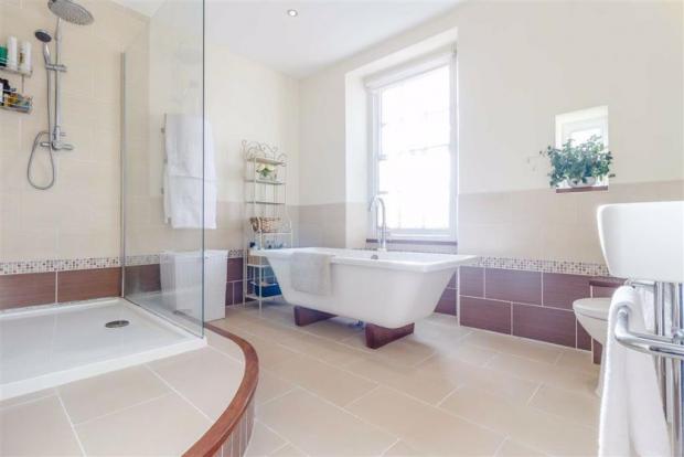 Free Press Series: A bathroom inside the property - complete with a freestanding bath (Credit: Archer & Co)