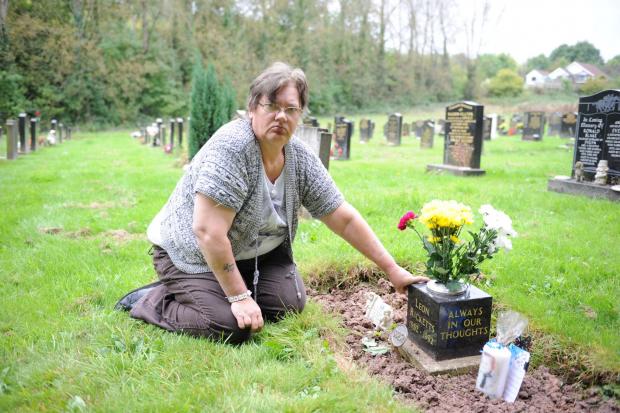 Free Press Series: Cheryl Downes at her son Leon's grave in Panteg Cemetery in 2014.
