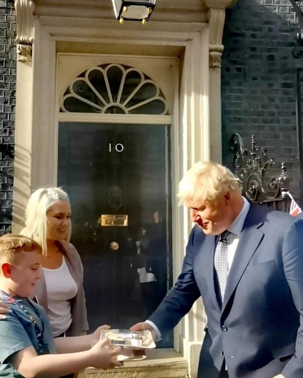 Free Press Series: Charlotte Hill with her son Theo presenting some Blaenafon Cheddar Company cheese to Boris Johnson. Picture: Charlotte Hill.