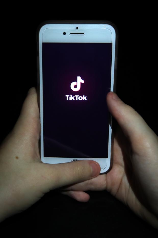 Free Press Series: A person with TikTok open on their phone. Credit: PA