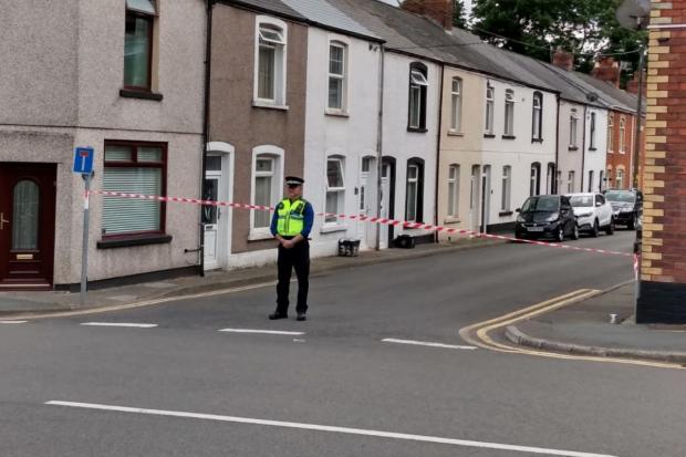 Free Press Series: Grove Place was cordoned off by police well into the afternoon.