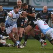 Jamie Roberts of Dragons is tackled by Brad Thyer and Josh Turnbull of Cardiff Blues. Picture: Huw Evans Agency