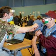 A member of the Armed Forces administers a vaccine in Wales earlier this year. (Picture: UK Government)