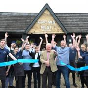 Roy Osmond - a regular at the pub for 58 years - cut the ribbon at the reopening
