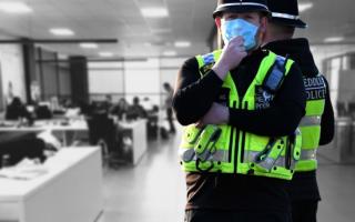 Composite image showing two police officers in Wales and a stock photo of an office. Original pictures: Huw Evans Picture Agency (front)/Pexels (background)