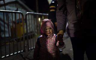 A young Ukrainian refugee crosses the border point from into Poland due to the Russian invasion. Picture: Victoria Jones/PA Wire