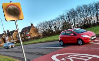 A car exiting the 20mph limit at Newport Road in New Inn, Pontypool where the 20mph sign has been vandalised.